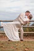 My wedding dress was so beautiful. It fit really well along my waist and arms. I am short though so I did have to get it hemmed. I would highly recommend it. - Katelyn O.