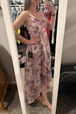I love the high low look and how pretty this flows when you walk. The material is soft and airy. I have to wear a strapless bra with it because there is no support but that's okay. I like that I can adjust the straps so that it fits my body better. There are little gold threads throughout that shine and look pretty. I tried both a small and medium and stuck with the medium. The small was just a tad tight around my rib cage. - Jordan L.