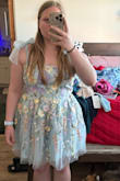 Too poofy and flares out too much. I wish it fit me better! I would've loved it so much! I ordered a size up (XL) and I'm normally a large. It was actually big on me! I had lots of extra room. I do have love handles and a little bit of a belly so I was surprised when it was too big! I love the 3D floral details on it. So gorgeous, just wish it wasn't so much like a mini ball gown. - Kelly G.