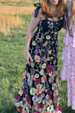 Wore to a vineyard for sorority moms outing (I'm 54) and received SOOOOO MANY compliments on how striking the dress is. I was concerned when ordering if it would fit (especially the length), but the medium was perfect (I'm usually a size 6 or 8 in other brands) Wore 4" heels w/ a 1" platform & the dress never hit the ground (was prob 1.5" above the ground.) Wore with a strapless bra (if you're small busted, you prob don't need one as the dress torso is pretty fitted.) Because I am larger busted, I found that the organza shoulder straps did loosen over time during the night & I re-tied them twice (maybe I could have double tied? Or maybe I'll have the seamstress sew some black straps on under the pretty organza straps?) I brought the dress to the cleaners before wearing it for "press only" since it shipped in a bag (only $10 to do this - SO worth it to have the flowers lay a little flatter - esp those on the side seams.) The dress is truly **STUNNING** with the embroidered and 3D flowers - very versatile too. - Lisa R.