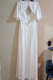 It's a beautiful dress; the fabric is smooth, shiny, and soft. I feel very comfortable in the dress. It has excellent volume. It's perfect for my civil wedding. - Alejandra A.