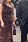 The most gorgeous color dark plum with a brownish hue to it. I got this as a guest wedding dress and loved it! I am 5'8 and I wore wedges; length was perfect. The side slit goes high, up to my upper thigh, but I loved it! Fit is stretchy and comfortable to wear for 8 hours and dancing, no problem. I ordered a small, and it fit like a glove but not too tight and not loose, nor bunchy. I'm a size 8 to 10 normally. Got so many compliments on it. I highly recommend. The one shoulder fits great and complements body type. - Christi P.