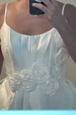 I love this dress, the flowers are beautiful. Great quality and beautiful fabric. Better than I expected. I had to exchange the size. I'm usually a size XS but it was kind of tight so I exchanged it for a S. - Dana E.