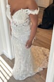 The dress fits nicely, a little loose in the shoulder part. Overall, rate this dress 8.5/10. It will be perfect for a bride on a budget or beach wedding. - Moesha W.