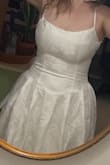 Dress is a LOT better quality than I was expecting for the price! Truly beautiful. Unfortunately just doesn't work with my bust, but otherwise truly beautiful, and the floral pattern is stunning. The only downside I might add would be the straps, as they didn't feel super duper durable if I was to wear this all day though out wedding festivities. - Bethany B.