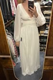 This dress has little silicone pieces to keep the shoulders in place, but it was not enough for me. The deep V in the front and back meant when the shoulders slipped, they slipped ALL the way off. - Megan K.