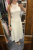 I wanted to love this dress, but the top was less structured than I expected. The fabric was thin so I couldn't go braless, and the low back left silicone cups as the only option. The bow in the back was also thick and hard to lay in a flattering way. - Megan K.