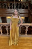 I fell in love with this dress the moment I put it on. I received it quickly and wore it to a wedding a couple of days ago. I'm a little on the short side, so I had it hemmed about two inches even with my heels. The one strap without the bow kept sliding down my shoulder, so I had it altered/shortened a bit to make sure it would stay in place, but it wasn't absolutely necessary if you don't slouch sometimes, like me. Although there are no pads/support in the bodice, I was pleasantly surprised that I didn't even need nipple covers since the pattern hides everything. Unfortunately, I did wear bracelets with this dress and found out during the wedding that the dress started to fray because of them! You can't really see it in any of the pictures because of the pattern, thankfully, but up close you can, and it makes me question the quality. (img 2) I recommend not wearing bracelets or at least not ones that could catch the dress! Overall, super satisfied, many compliments, and I felt so confident and beautiful all night. - Lois S.