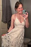 This dress is adorable and I'm excited to wear it for my bridal shower. I didn't give 5 stars for 2 reasons. 1) The left side on the chest seems like it was sewn a little crooked or something; it doesn't quite lay as nice as the other side. You can sort of see it in the photo by my arm. I probably could've exchanged for a new dress but didn't feel like it was worth the hassle. 2) I wish the spaghetti straps were a little higher quality; it's a little difficult to get it tied to my liking. I have CAKES nipple covers on in this photo. The material is thin so you'll probably want a little something on underneath. However, as a tall girl, I'm happy with the length. - Kaitlin K.