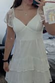 The color on the top of the dress (bust area) and the layer below are slightly different colors. The top is a little more white and it looks odd. Also too big on me. Returning - Cora B.