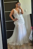 It's the most beautiful wedding dress I've ever tried on!!  The fabric quality is excellent, and it fits your body shape perfectly. I recommend it if you're a curvy woman. I can't wait to wear it on my wedding day. - Alejandra M.