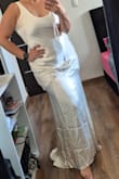 The dress is a beautiful color, light and fresh. If you're a curvy woman, it's probably not your best option because it doesn't highlight your waist. I loved the dress in the photo, but it wasn't the best fit for me. It's a beautiful dress and very good quality for its price. - Alejandra M.