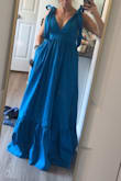 The material was great, and I loved the pockets! The dress was too long. Even with 4" heels on, I would have needed to hem it at least 2-3". The zipper was also quite difficult to manage. I loved that the shoulders untied and I could re-tie them to fit my short torso, but unfortunately, when I got the torso to hit right there was so much extra fabric for the ties it looked messy. Also, beware the sides are kind of low, necessitating a sticky bra/nipple cover type situation if you don't want bra showing. - Katie T.