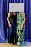 This dress is beautiful, I love how flowy it is, and the colors are vibrant. It is LONG. I'm 5'9" and wore 2" heels and still had to pin the dress up with safety pins because I didn't have time to get it tailored - Allison G.