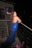 I wore this to my junior prom and fell in love with it! The dress fit perfectly all the way around. I'm 5'2, and with heels, it was the perfect length, and for the bust area, it fit perfectly with a sticky bra even with my small boobs. The abdomen area didn't accentuate my belly, so I didn't need to wear shapewear or anything (so so nice). I especially LOVED the little train on this dress as it gave it an extra flair and made it stand out from the hundreds of blue sequined dresses I saw at prom. The stringed up back looked amazing, and I recommend an updo for the hair to show it off. Overall beautiful and I'll definitely be wearing it again! - Maria P.