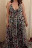 It's a little too long for me, but it's very beautiful and I can't wait to wear it. I bought a M and it fits perfectly. - Sara S.