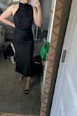 Like other reviews say, the asymmetrical design is way more obvious in person and is a bit off. It doesn't look quite right. I'd say it runs true to size but if you have any sort of pooch, you'll want some GOOD shape wear. This dress doesn't have any give so it's hard to get on and off. The material feels nice. - Mary H.