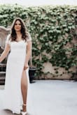 The dress was beautiful and the material was light and classy. I loved the slit for the leg. It fit nice around my waste and I liked the open back. - Jocelyn C.
