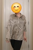 The pattern is unique without being too much. Fabric is nice and the loose fit works perfectly. I didn't realize how the cut in the back worked until I received it, but it's nice and actually great in the heat for a little more airflow. The sleeves were quite long, but I think that's because I had to order and XL to accommodate my bust. - Enna P.