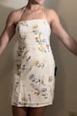 I wanted something that was a little more exciting than the basic white dress, and this one absolutely delivered. It fits perfectly to size and really complements my athletic build (where are my gym girlies at)! I LOVE the lace-up back. The color is the palest yellow, which is really pretty and definitely makes you look tan. The material is surprisingly super comfy too, which I wouldn't have expected for a dress like this. Overall, I love it and will definitely be using this dress long after graduation! - Sierra R.