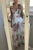 I was looking for a dress for my rehearsal dinner in Mexico.  I returned so many short white dresses, but then I found this one and I'm obsessed with it! I tend to have a hard time finding dresses that fit because I'm tall, athletic, but super small chested and I'm usually between sizes.  The tie factor on this dress works perfectly for me! I bought it in a medium and couldn't be happier!  It's super flowy, but so classy and pretty.  The only issue is the snap closure on the chest doesn't align on me once it's on, but it can easily be moved.  Other than that, I'm so happy I sprung for this dress!!!!! - Melissa G.