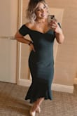This dress was absolutely stunning. The smooth and stretchy fabric hugged my body in all the right places. Although the material was thick and nice, I found the hip area to be slightly loose. The top fit perfectly, so sizing down wasn't an option. Overall, it's a great dress. - Maria B.