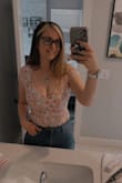 I wish this was made of a more stretchy fabric. It fit well in the chest area. But I have a lot of difficulty with snapping it up. I wish it was longer. - Candace J.