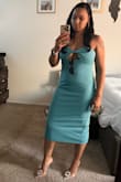 This dress has a nice length and fits perfectly. The twist in the front shows just enough to make it sexy. - Brittany L.