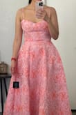 Top part of the dress is nice and fitted. However, the bottom portion of the dress is extremely unflattering. The skirt is way too wide, making it look like my hips are larger than they are. Disappointed and returning. - Bianca M.