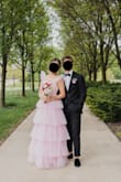 My daughter wore this for her prom. It looked absolutely beautiful and so many people complimented her dress. We did "hem" it by cutting the tulle with a rotary cutter. I thought we would cut some of the wings off the shoulders but when all was said and done, I think they looked perfect with the dress as is. I steamed all the layers and I think this was an important step to making it look more expensive. There were some threads hanging as others have said, but we decided to leave them be vs. cutting them off and having something unravel. I still can't believe the price! It was perfect! - Traci F.