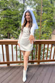 Okay this was the cutest bachelorette dress ever! I received so many compliments. It's lined underneath so the dress is not see through. I danced for 5 hours straight and never sweated through the dress. It wasn't too short and it was very comfortable. The sleeves are everything!! - Michelle B.