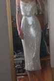 I love this dress and can't wait to wear it IRL! I will say, as a small chested gal, the top part was a bit loose, as were the straps, but the rest of the dress accentuated my figure PERFECTLY. I bought this dress as a back up for my wedding reception as I'm currently having a few issues with my actual wedding dress, but now, even if my issue is sorted, I might change into this dress at some point in the night just because! One thing to note, however, although not a deal breaker for me, the zipper was a bit tough. It felt like every time I'd try and zip it up, it would get caught on sequins. - Kat G.