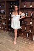 Loved this dress! I wore it for my bachelorette party (wine tasting and dinner). I love how its flowy but doesn't make you look big. It was so comfortable and I felt confident in it. The only thing is that it wasn't really holding in the girls as well as I'd like and I don't have large busts. So if you are on the larger size up top, there may be some spillage. Otherwise, it's not as short as I thought it was gonna be; it was perfect! - Barbara C.