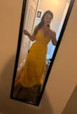 I thought I was taking a risk with this dress because of all the tiers. I'm bigger on the bottom and was worried that the ruffles would make me look very wide. It's quite the opposite- the material is so flattering. I am really impressed with the quality and texture of the material. It is a bit long, but that's normal for my height. I absolutely cannot wait to wear this! - Andrea S.