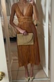 This dress was on sale so I gave it a shot. It's a little less orange in person but love the fit, doesn't gape open at the chest. I will probably wear to a fall event later on. - Maguire L.