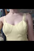 I ordered the Sophisticated Charisma Tie-Strap A-Line Midi Dress in light yellow. It fits well in the waist and hips, and I love the way the fabric moves! However, the bust was very poorly constructed and had excess fabric at the top, making the top of the bra cup area puff up and look very strange. It looked so bad it was unwearable. Thankfully, I have limited sewing skills and was able to rip and re-sew some seams to make it look much better. I will love wearing this as a bridesmaid dress, but I would not recommend anyone buying it unless they are prepared to do some alterations. - Alexandra L.