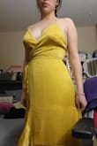 The dress is beautiful. The color is not as bright at the picture, but still very nice. It fits a little tight around the hips and I'll have to relace the back for the top to sit right, but overall, it's nice. - Angelique R.