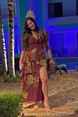 I ordered this dress for our 15th wedding anniversary vacation to Cancun. I've had compliments on it every time I've worn it since then. It does have a slit in the leg so when the wind blows it almost looks like a high/low style instead of tiered. I'm a bit taller so I have to be careful the slit doesn't show too much. Length was perfect for me, but may be too long for someone shorter. I would have needed to size up if my bust was any larger. There is no give in the rib/bust area. - Rebecca K.