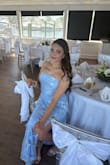 I loved this dress! It runs small. I usually wear a medium and ordered a large because that's all they had. I got it taken in and it fit great. - Carolina R.