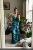 I read the reviews and sized up this dress. I normally wear a size small in lulus dresses. Ordered a medium and it fit perfectly. Due to my height, 5'3, the dress is a maxi. - Lisa C.