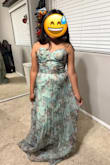 The dress is beautiful, but sooooo small. The XL I ordered fits like a small. I had my 10 year old daughter try it on as a joke just to show how small this thing is. She is like 4'10 and 115 lbs. The cups would probably fit someone up to a C cup. Come on Lulus! - Erica A.