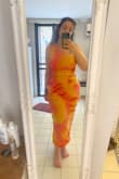 The dress has a nice quality but the color is not at all the same as the picture - it is way more orange than yellow. And the yellow is not at all a soft one. The dress was also longer than expected. - Anaelle M.