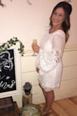 I wore this to my bridal shower and received so many compliments! I typically wear a L or 10/12 sizes, and in this dress I ordered both a L and XL. I decided to keep the XL because although I wanted a more form-fitting dress, I did want anything skin tight and the XL was perfect for what I was envisioning. - Jessica L.