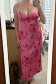Really tight in the chest and not stretchy at all. Love the color, and I think it's really cute. Only issue I have with it is that the tie in the back loosens within minutes because the fabric is slick ,so I'll have to pin it in place or I'll be adjusting it all night long. - Natalie D.