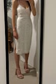 Bought this dress for graduation and I love it. I ordered a S and feel like it runs true to size. I'm a 36D and definitely couldn't go any smaller in the bust, but I like that I don't have to wear a bra because it's snug. Sequins/ beads seems to be of good quality. - Sophia H.
