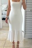 This dress fits beautifully, is so well done. The fabric is gorgeous, and it looks expensive. I love how the fabric flows and how it's shaped. I love the lower back and the whole fit. - Monica P.