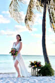 I tried on quite a few dresses before picking this one for my Florida beach elopement. It fit like a glove, was lightweight and packable without having to press it. I had a few inches taken off the bottom and purchased sticky cups to support me. I was a nervous about it being a little see through but the photos came out perfect. It was breezy and it flowed perfectly in the wind! I received so many compliments in this dress! I felt sexy and beautiful! - Carrie H.