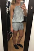 I listened to the reviews and ordered a size up (usually a small, ordered a medium) and I should've stayed true to size. I thought about re-ordering but decided against it because of the neckline and the material. Since it's backless you can't wear a bra and the material is too thin for me to be comfortable going bra-less. Also, the neckline on the model is more rounded but is straight in person. I tried tying it at multiple lengths but the neckline stayed straight across no matter what. Overall it's a cute romper, it just isn't for me. - Kelsey S.