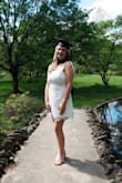 I ordered this dress for graduation and I'm so happy I did! I received so many compliments on it. I felt so pretty while still feeling that the dress wasn't too revealing/was mature enough for a graduation ceremony/pics. I'm usually between a medium and a large, so I ordered both. The medium probably would've been too tight on my chest, but I honestly don't remember because as soon as I put it on, I realized it was way too short. The large fit perfectly and was the perfect length. The bows are such a cute detail and I didn't think it was too hard to tie them nicely. The zipper on the back of the dress is definitely a little tricky even if the dress fits well--I needed help zipping it almost every time I put it on. The dress itself was thick and didn't show nude undergarments--would probably show black a little as most white dresses would. Overall, it's such a nice quality, beautiful dress for a reasonable price! - Lily