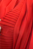 The dress just arrived 5 minutes ago. When I took it out the package, there was loose threading in several areas. It's a pretty dress, but the stitching doesn't seem very secure, which is disappointing for a brand-new item. I was hoping for better quality. - Desha T.